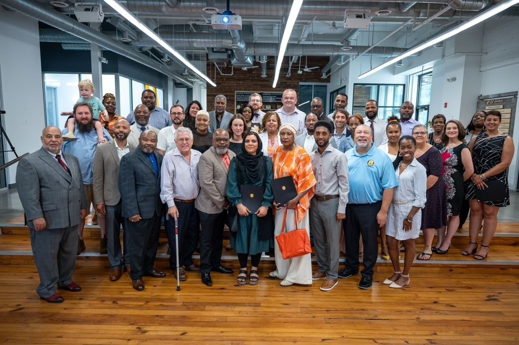 Mayor Brandon M. Scott with group of people